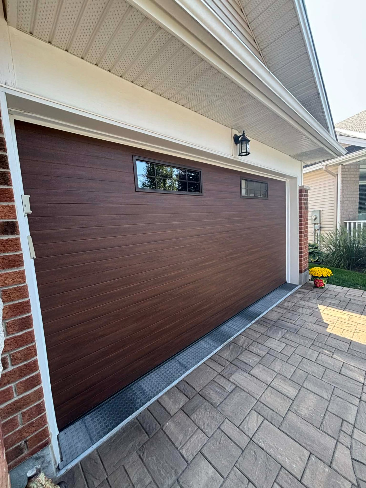 Wood-tone insulated garage door